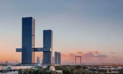 two tall skyscrapers in a city at sunset at One&Only One Za'abeel in Dubai