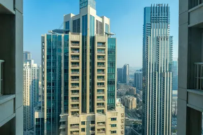 a view of a tall building in a city at Bellavista - High Floor - 1BR 29 Boulevard - Burj Khalifa & Fountain View in Dubai