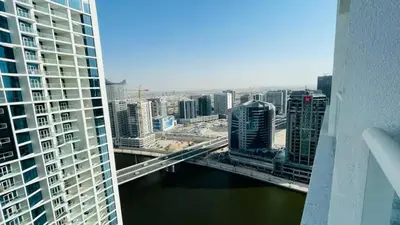 a view of a bridge over a river in a city at Canal View, Luxurious Studio In Downtown Dubai in Dubai