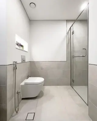 a bathroom with a toilet and a glass shower at Spacious 2 bedroom in Madinat Jumeirah Living in Dubai
