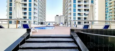 a stairway in a city with tall buildings at 50% OFF Summer Offert, Nice w/ Balcony & Pool View in Dubai
