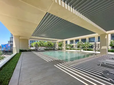 a swimming pool in a building with a building at Silkhaus in Burj Royale, stunning 1BR in Downtown premium tower in Dubai