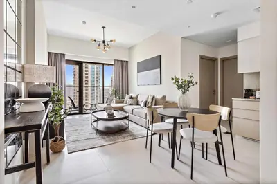 a living room with a couch and a table at Silkhaus sophisticated 1BDR in Downtown premium tower in Dubai