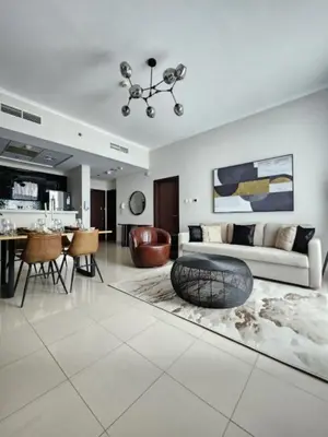 a living room with a couch and a table at Nasma Luxury Stays - Marina-View Oasis With Balcony Steps From The Sea in Dubai