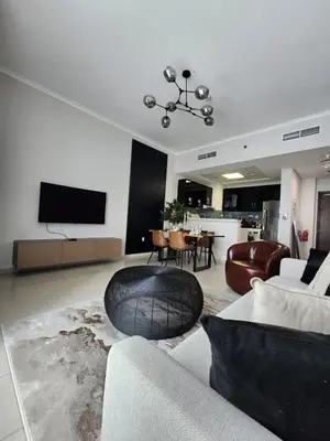 a living room with a couch and a table at Nasma Luxury Stays - Marina-View Oasis With Balcony Steps From The Sea in Dubai