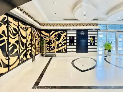 a lobby with black and white walls and a basketball court at Cosmos Living Dubai Arch Tower Pool, Gym & Balcony in Dubai