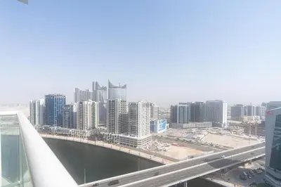 a view of a city with a bridge and buildings at Gala Guests - Maison Prive Canal View Collection in Dubai