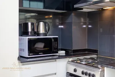 a microwave sitting on top of a kitchen counter at Marco Polo - Enjoy comfort and class near Burj Khalifa in Dubai
