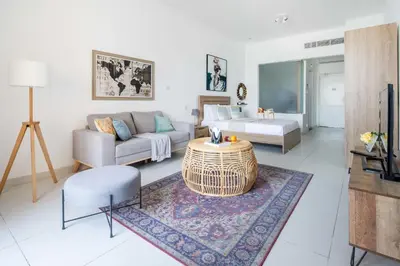 a living room with a couch and a table at Frank Porter - Palm Views East in Dubai