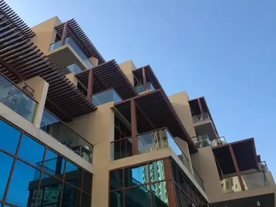 an apartment building with balconies on the side of it at Frank Porter - Palm Views East in Dubai