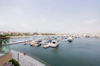 a bunch of boats are docked in a marina at Frank Porter - Palm Views East in Dubai