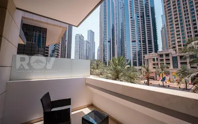 a balcony with a view of a city with tall buildings at Studio with Boulevard View in Dubai