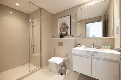 a bathroom with a toilet and a sink and a shower at SmartStay at Burj Royale - Full Burj Khalifa View - Brand New Luxury Apartments in Dubai