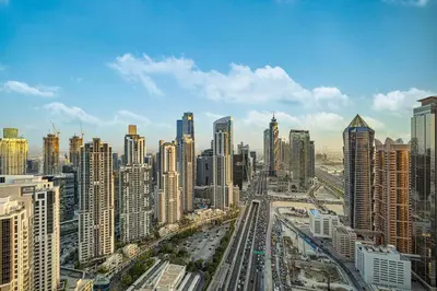 a view of a city with many tall buildings at Luxe 2BR with Burj Khalifa View & Infinity Pool in Dubai
