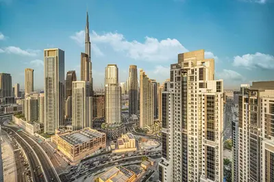 an aerial view of a city with tall buildings at Luxe 2BR with Burj Khalifa View & Infinity Pool in Dubai