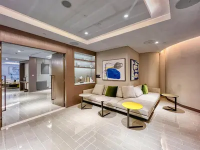 a living room with a couch and a table at Luxury 2BR Apartment with Stunning Burj Khalifa & Fountain Views - Opera Grand, Downtown in Dubai