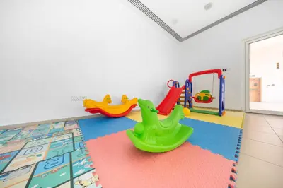 a childs play area with toys on the floor at 1Br Suit with Full Canal View - Down Town in Dubai