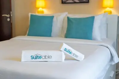two towels on a bed in a hotel room at Hidden Gem 1 Bedroom apt in Dubai Sport City in Dubai