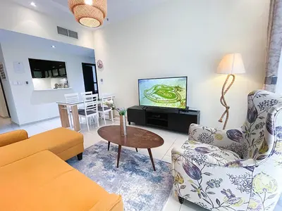 a living room with a couch and a table at RH- City Living in Style, Large 1 BR with open Terrace, Dubai Marina in Dubai