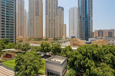 a view of a city with tall buildings and trees at Frank Porter - Bonaire Tower in Dubai