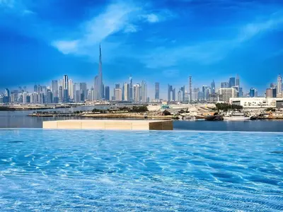 a view of a city from a swimming pool at Fantastic 2BD apartment in Dubai Creek Harbour in Dubai