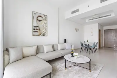 a living room with a couch and a table at Spacious 1 bedroom in Business Bay - Close to Downtown in Dubai
