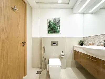 a bathroom with a toilet and a sink at Trophy - Downtown Skyline Sanctuary Suite in Dubai