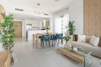 a living room with a couch and a table at Frank Porter - Creekside 18 in Dubai