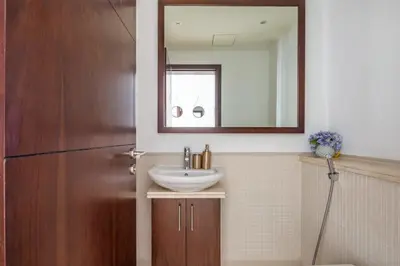 a bathroom with a sink and a mirror at Frank Porter - Beauport in Dubai