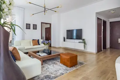 a living room with a couch and a coffee table at Frank Porter - Beauport in Dubai