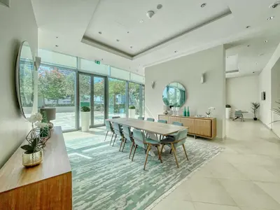 a dining room with a table and chairs at The Smart Concierge - Burjvista in Dubai