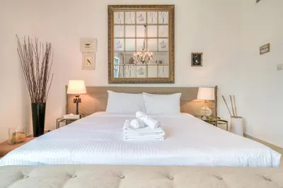 a bedroom with a white bed with a towel on it at Fairfield Tower, Park Island, Dubai Marina - Mint Stay in Dubai