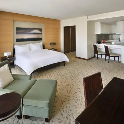 a large hotel room with a bed and a kitchen at Emaar Dubai Mall Residences - formerly Address Dubai Mall Residences - Burj Khalifa View in Dubai
