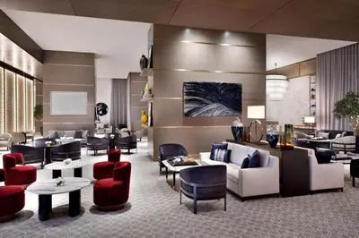 a hotel lobby with couches and chairs and tables at Emaar Dubai Mall Residences - formerly Address Dubai Mall Residences - Burj Khalifa View in Dubai