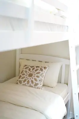 a white bunk bed with a pillow on it at Elite Royal Apartment - Full Burj Khalifa & Fountain View - Highness in Dubai