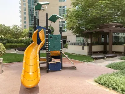 a playground with a slide in a park at Elite Royal Apartment - Full Burj Khalifa & Fountain View - Highness in Dubai