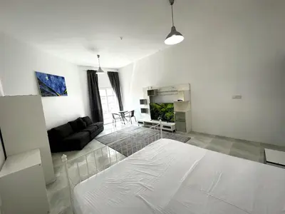 a white room with a couch and a living room at Nice Rooms for Rent in Compound Housing near Burj Alarab Dubai Villa 125 in Dubai