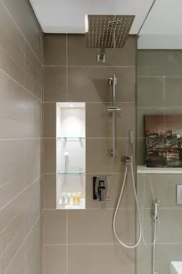 a bathroom with a shower with a glass door at Sleek 1 Bedroom with Views of Dubai Marina in Dubai