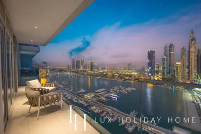 a room with a view of a city skyline at LUX The Ultimate Palm Sea Skyline Penthouse in Dubai