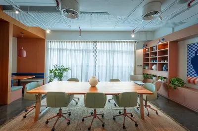 a conference room with a large wooden table and chairs at Shada Hotel Dubai - فندق شدا دبي in Dubai