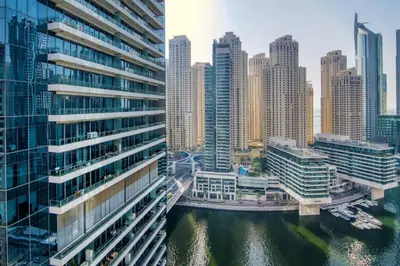 a view of a city with tall buildings and a river at The Smart Concierge - Silverene in Dubai