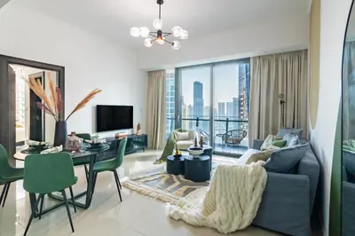 a living room with a couch and a table at The Smart Concierge - Silverene in Dubai