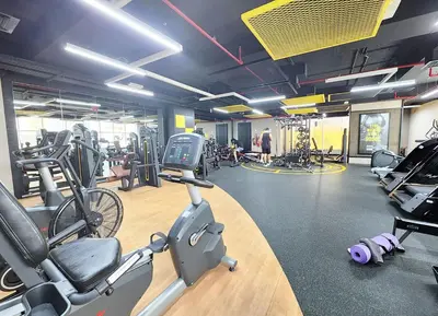 a gym with treadmills and exercise bikes in it at RH- Urban Living, spacious 01BR, near burj Khalifa in Dubai