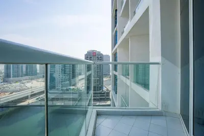 a balcony in a building with a view of a city at White Sage - Fancy Studio With Mesmerizing Canal Views in Dubai