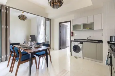 a kitchen and dining room with a table and chairs at Frank Porter - Bayz Tower by Danube in Dubai