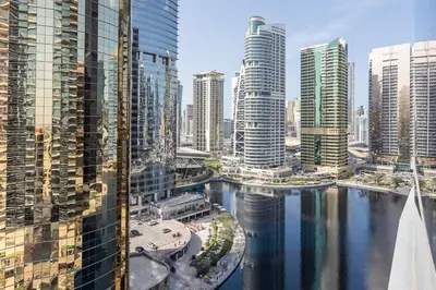 a view of a city with a river and buildings at Frank Porter - Concorde Tower in Dubai