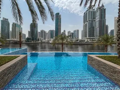 a swimming pool with a city skyline in the background at Frank Porter - Blakely Tower in Dubai