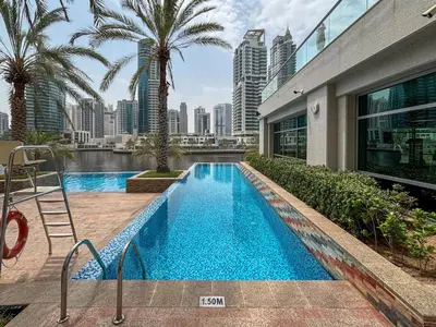 a swimming pool in the middle of a building at Frank Porter - Blakely Tower in Dubai