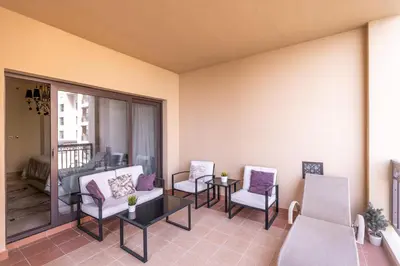 a living room with chairs and a couch at Daniels Sea View 2BR in Fairmont The Palm in Dubai