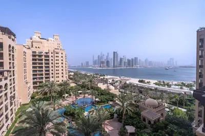 an aerial view of a resort with the ocean and buildings at Daniels Sea View 2BR in Fairmont The Palm in Dubai